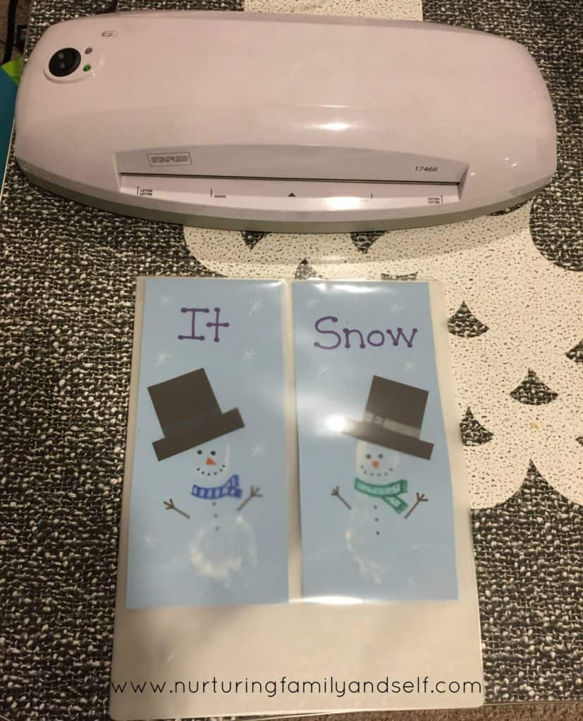 Laminating Finished Snowmen Footprints