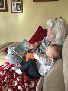 Reading with Babcia during Morning Snacktime